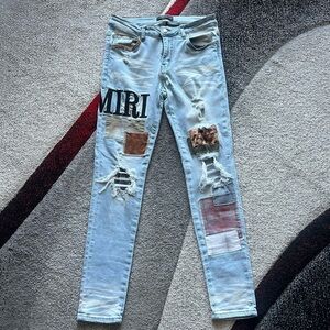 Amiri Grunge Light Wash Patchwork Distressed Jeans